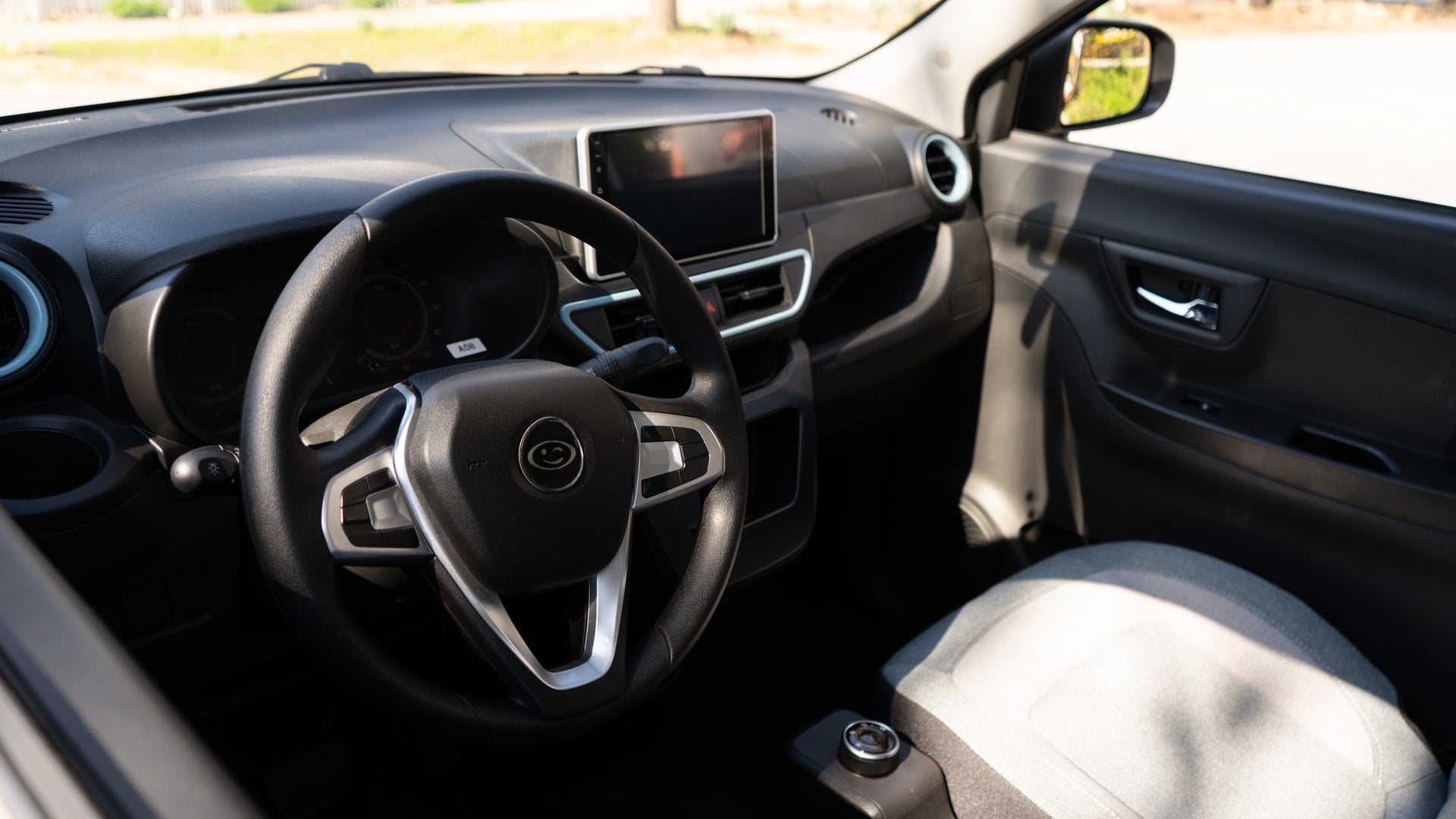 An interior shot of the Wink Mark3, a fully enclosed LSV with a Bluetooth entertainment system.